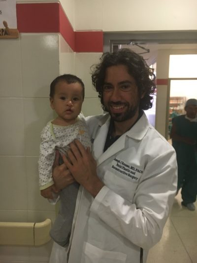 Dr Rousso on mission with his patient